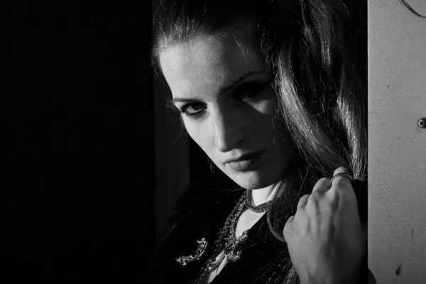 A woman interprets a Sin City Old Town girl in this film noir style portrait from the Sin City photo session in Amsterdam